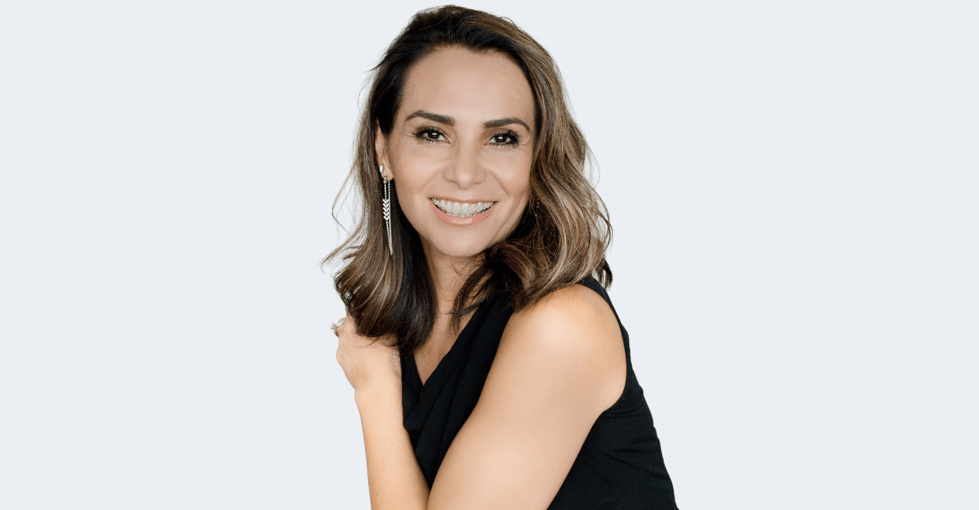 Professional portrait of a woman in a black top | Cedar Park Smiles
