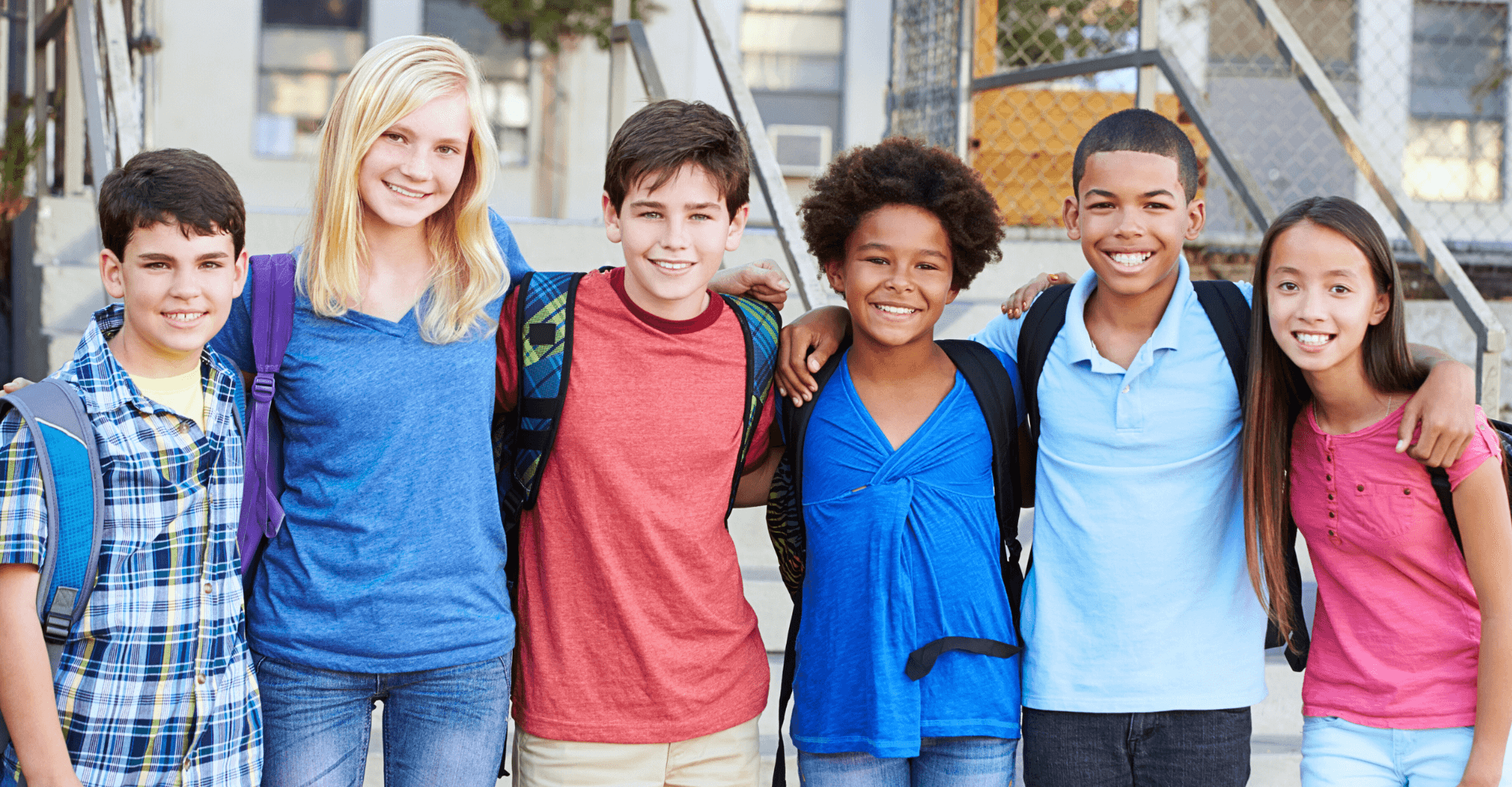 Group of diverse teenagers smiling together | Cedar Park Smiles