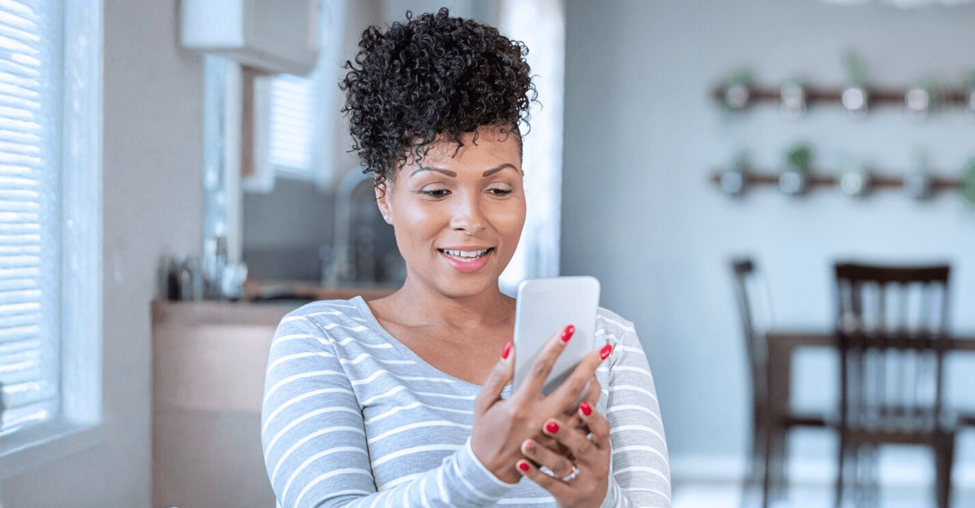 Woman looking at her smartphone | Cedar Park Smiles