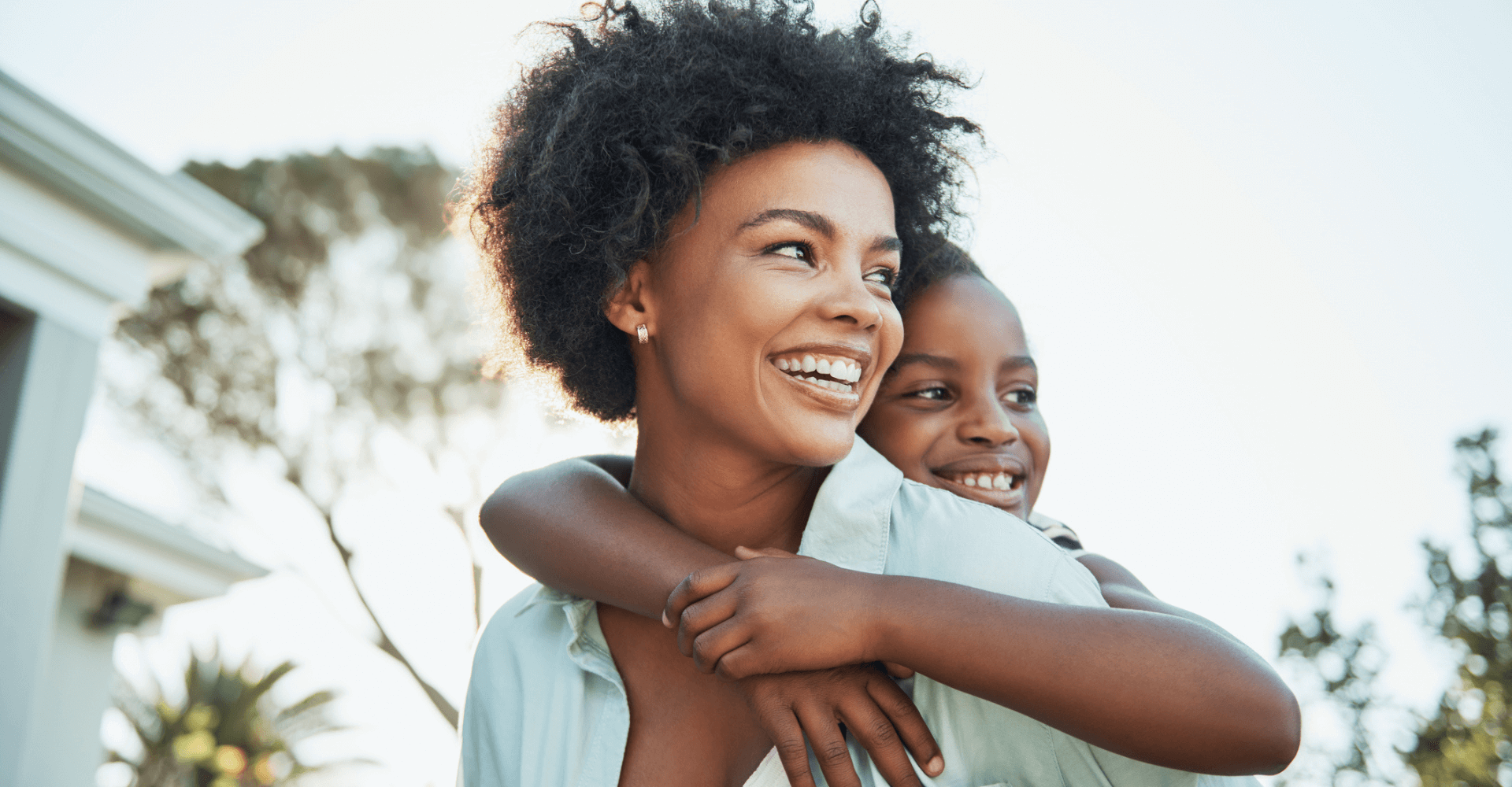 Mother and daughter hugging and smiling | Cedar Park Smiles
