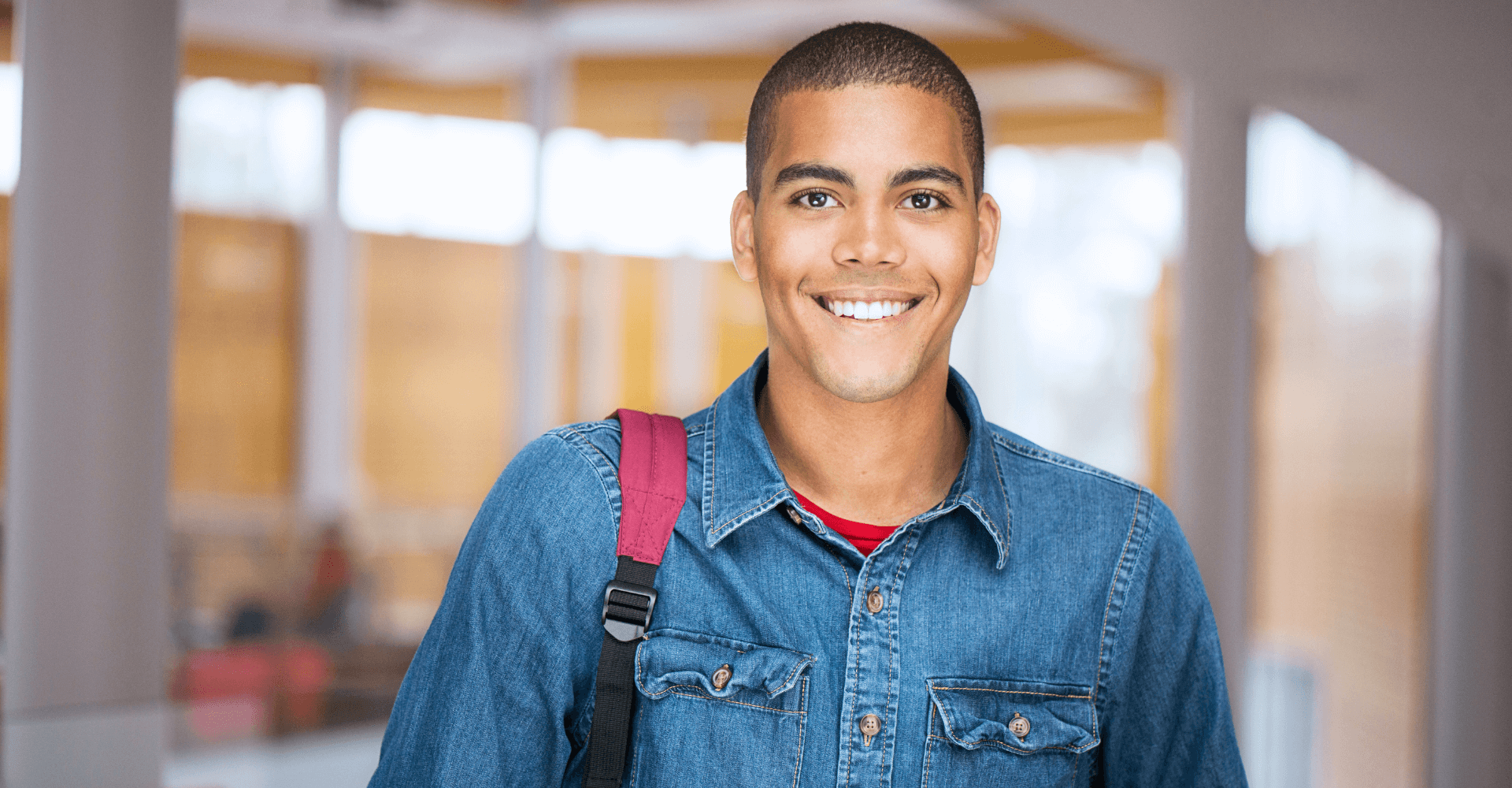 Young man with a backpack smiling | Cedar Park Smiles